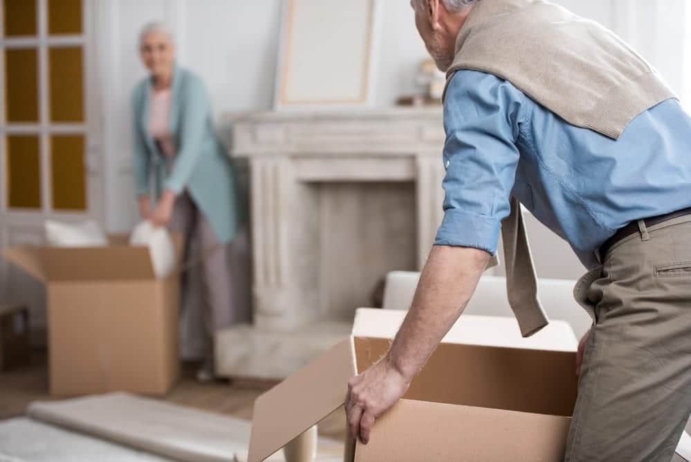 senior-couple-packing-up-cardboxes-in-home