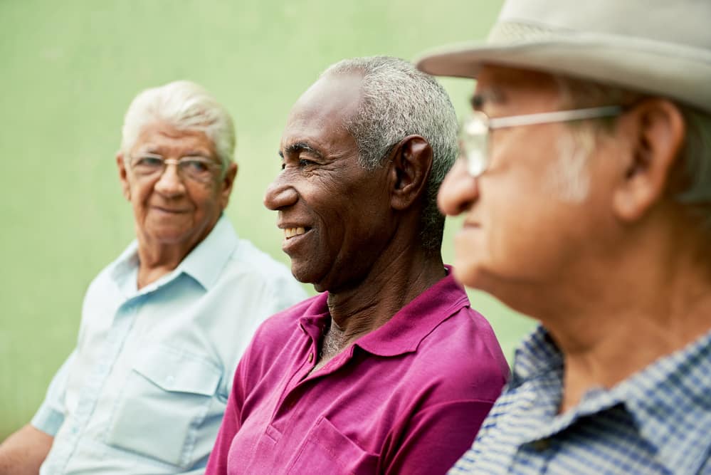 Three smiling senior men, close-up
