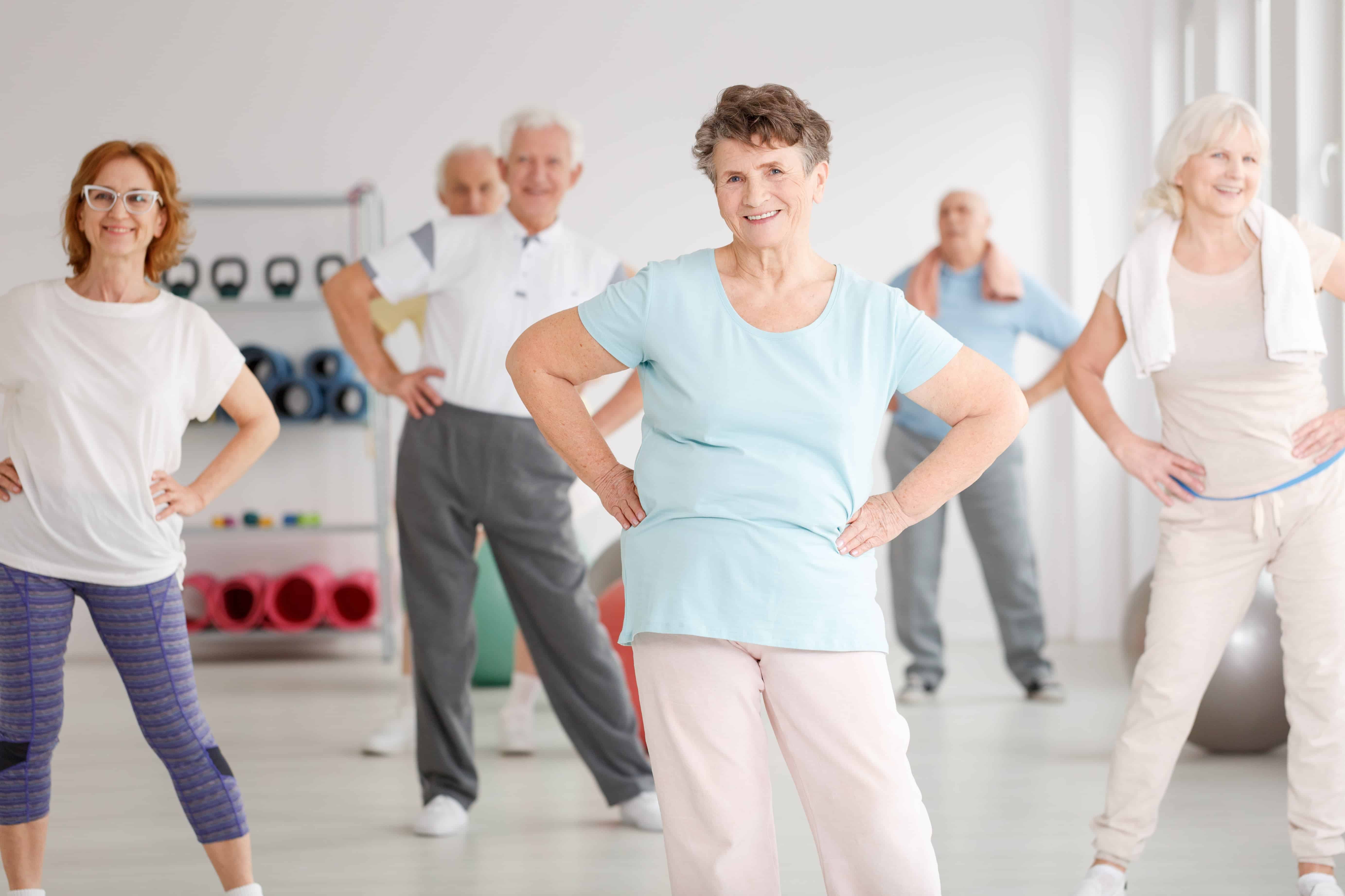 Smiling seniors in an exercise class